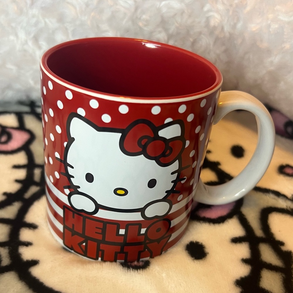 Brand new limited edition red and white polka dot and stripped Hello Kitty mug